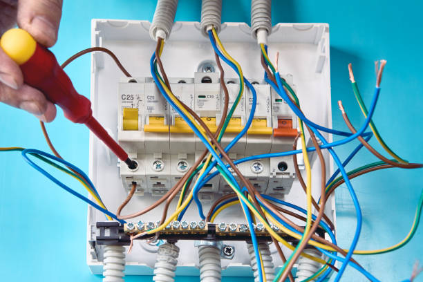 installing of circuit breakers in switchboard of consumer unit.